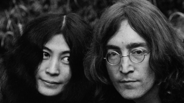 Yoko Ono leans toward John Lennon