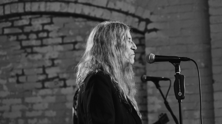 patti smith looking to side microphone