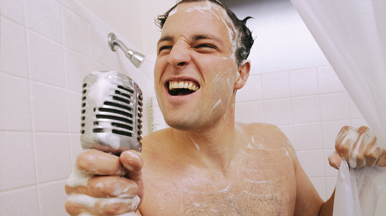 Dude rocking out in shower