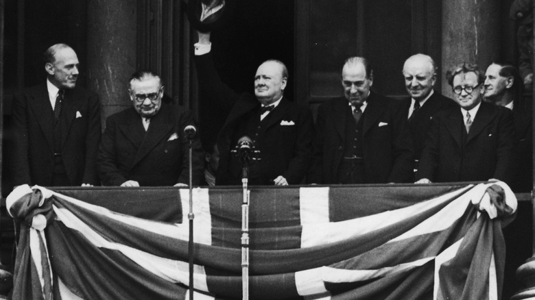 Churchill and men with flag