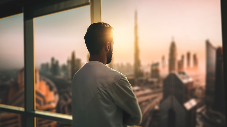 a man looking out a window