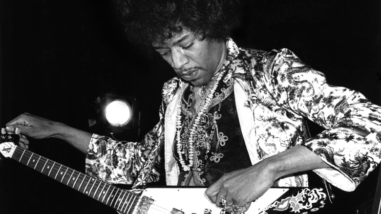 Jimi Hendrix tunes guitar