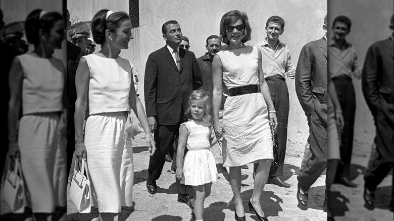 Lee Radziwill walking with Caroline and Jackie Kennedy