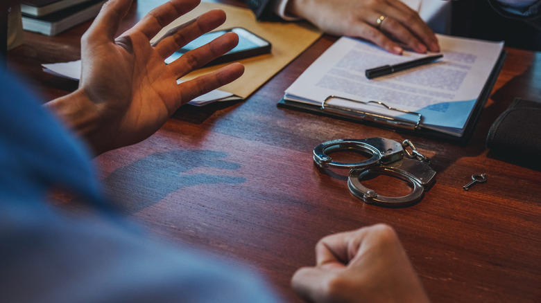 Police officer interrogating suspect 