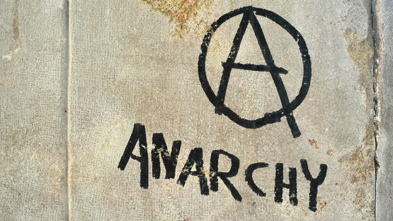 anarchist symbol spray painted on wall