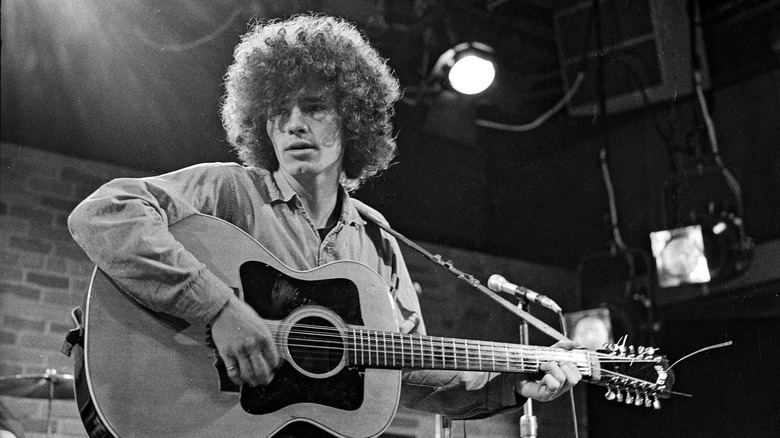 Tim Buckley playing guitar