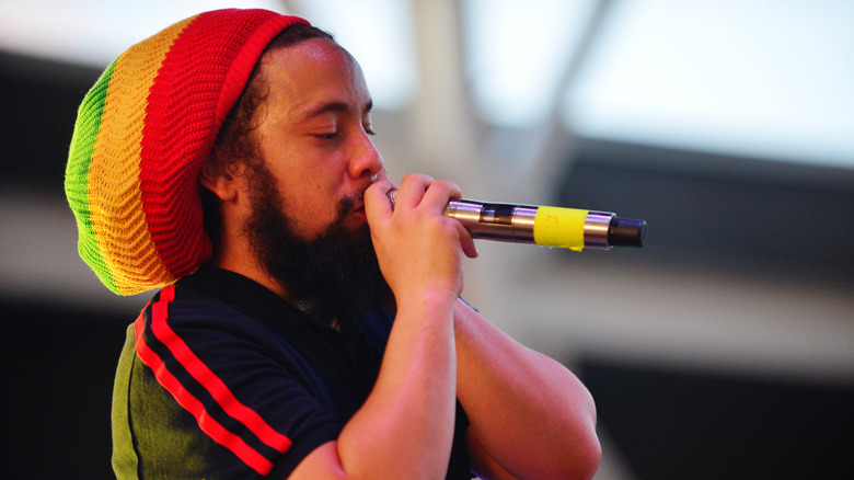 jo mersa marley holding microphone