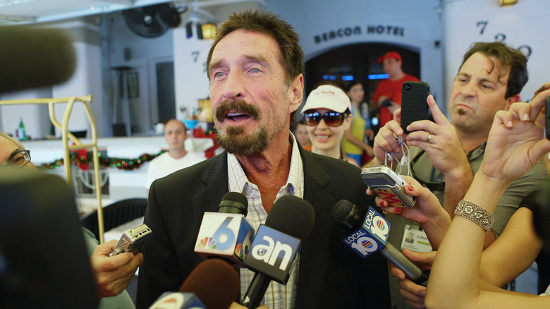 John McAfee talking to reporters