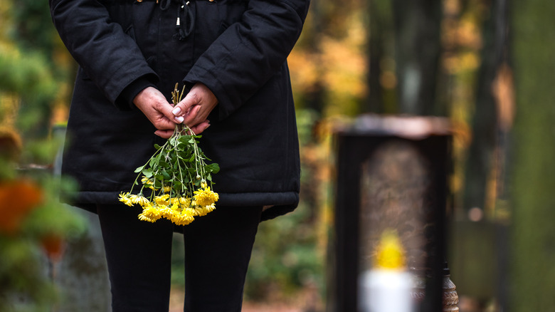 a mourner at a grave