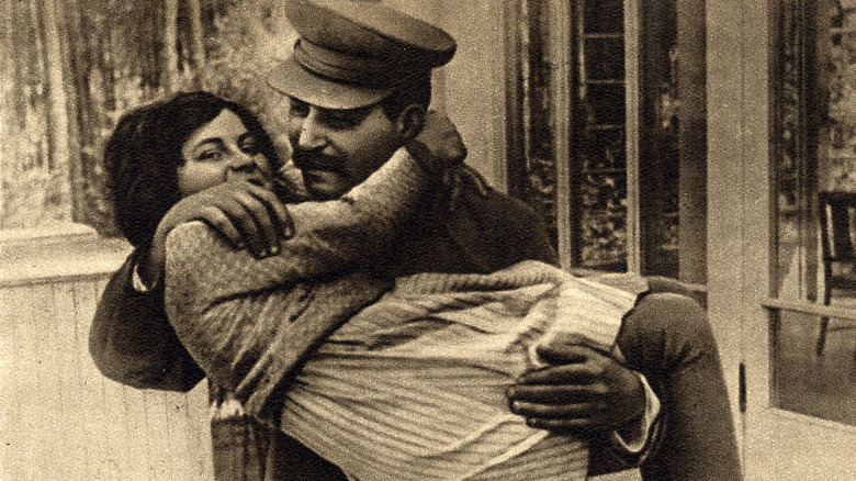 joseph stalin carrying his daughter