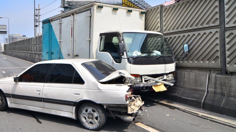 car moving van in crash against fence