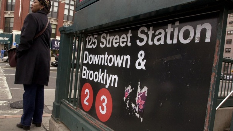 woman beside 125th Street station