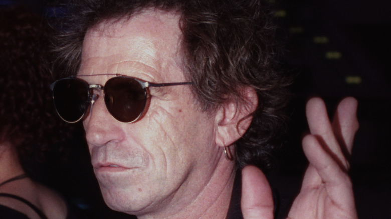 Keith Richards casually waving at camera