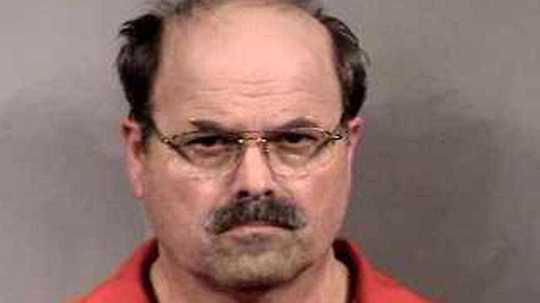 Dennis Rader looking grim in his mug shot