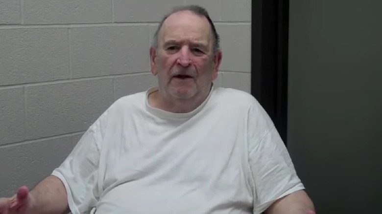 Edward Edwards in a white T-shirt speaking from prison