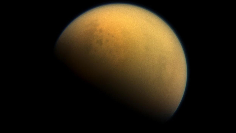 A glimpse of Titan's seas, through the clouds.