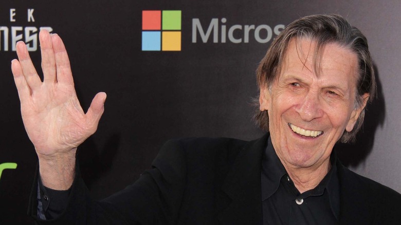 Leonard Nimoy with hand raised