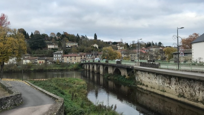 Aixe-sur-Vienne view of river and bridge in modern times