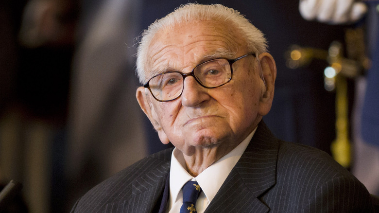 older nicholas winton solemn in suit