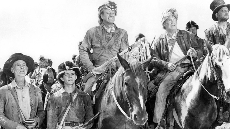 John Wayne (center) leads others