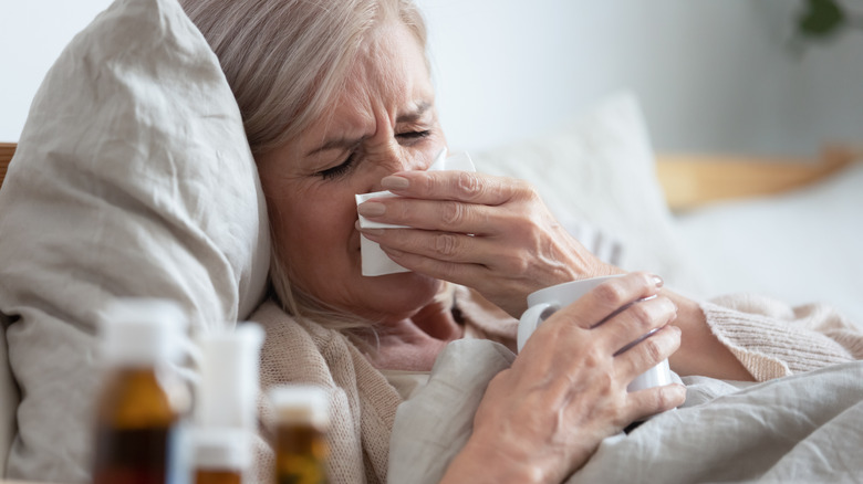 Sick woman in bed