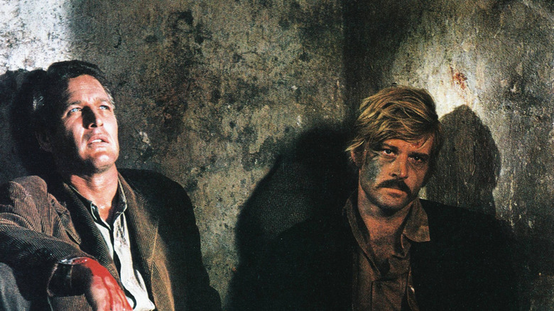 Paul Newman and Robert Redford slump against walls