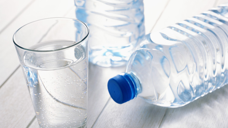 water in glass and bottles