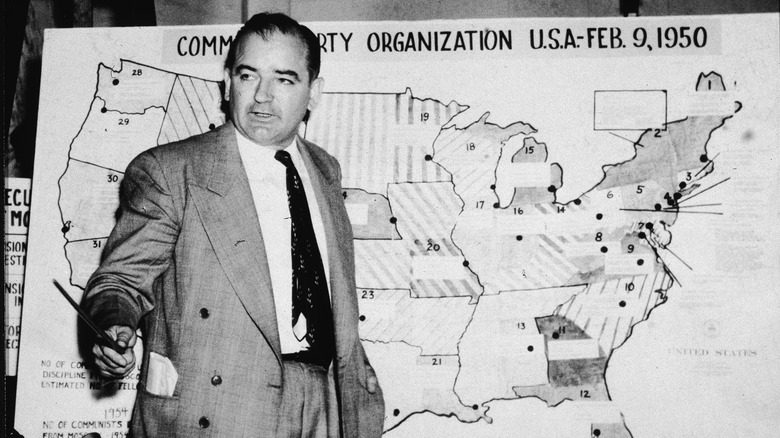 senator mccarthy in front of a map 1950s