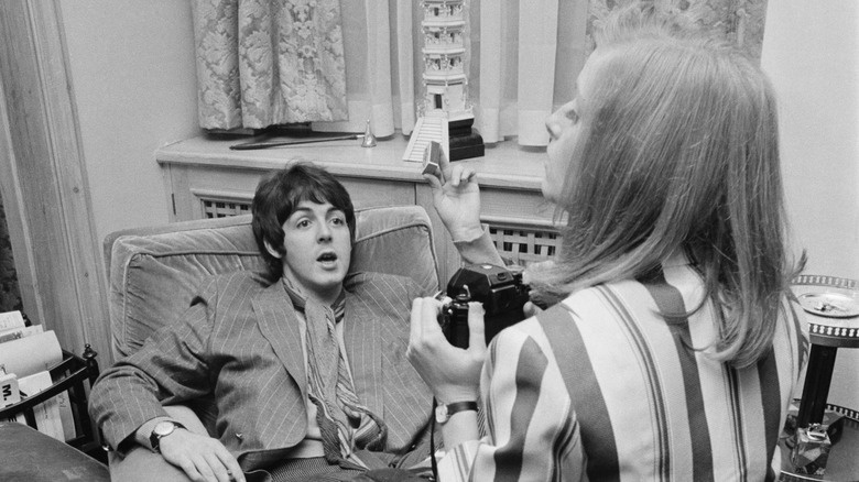 Linda taking a photo of Paul McCartney