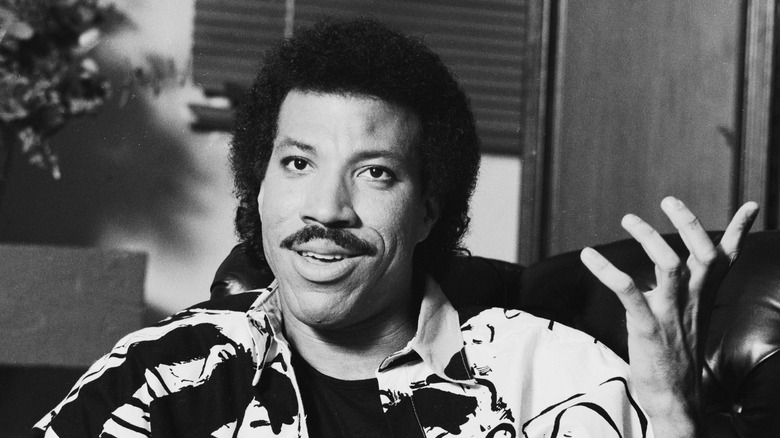 Lionel Richie gestures while speaking