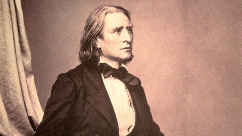 Franz Liszt posing in formal wear