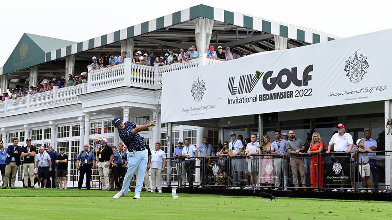 golfer hitting golf ball 