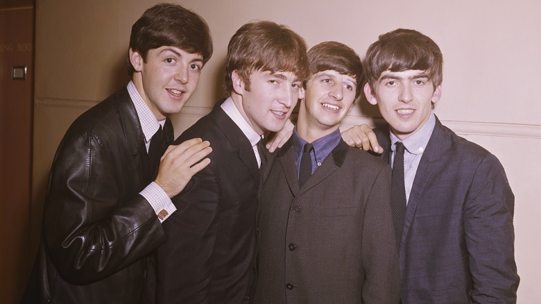 The Beatles posing for band photo