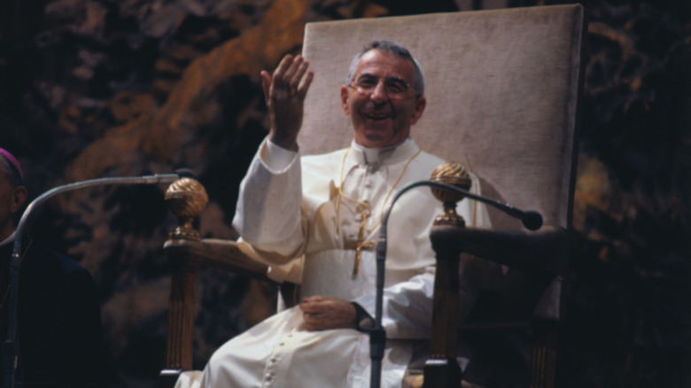 John Paul I sitting raising hand