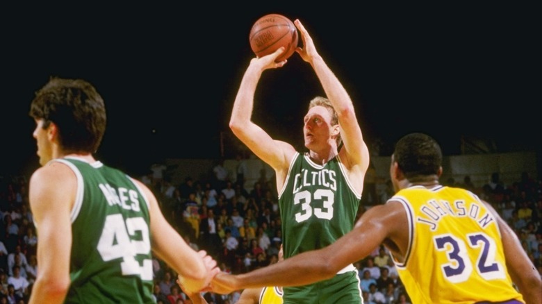 Larry Bird shooting the ball