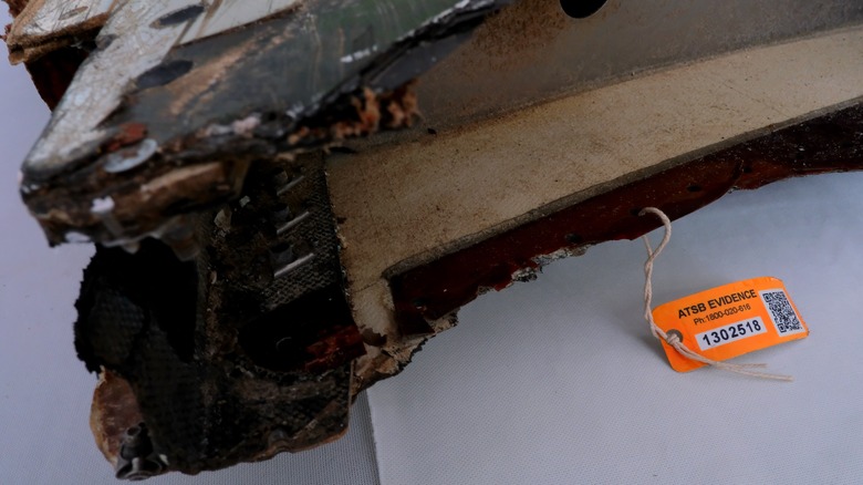 Wing flap from MH370 with orange tag