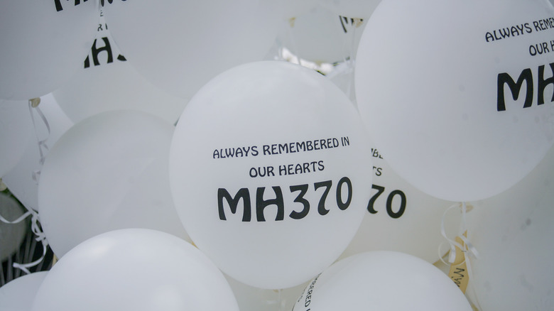 White balloons with memorial messages