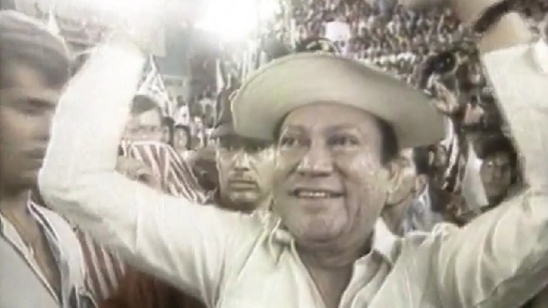 Manuel Noriega arms raised