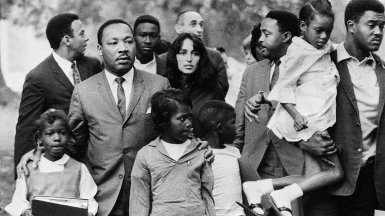 MLK and Joan Baez escorting school children in Grenada, Mississippi