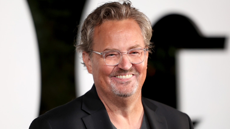 Matthew Perry smiling at event