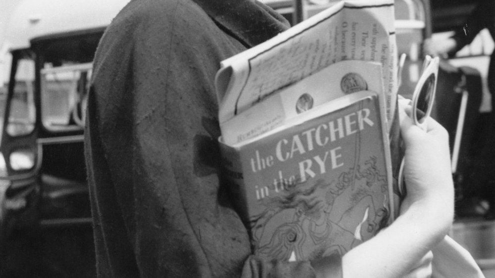 Woman holding Catcher in the Rye