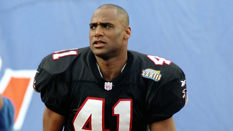 Eugene Robinson wearing football jersey