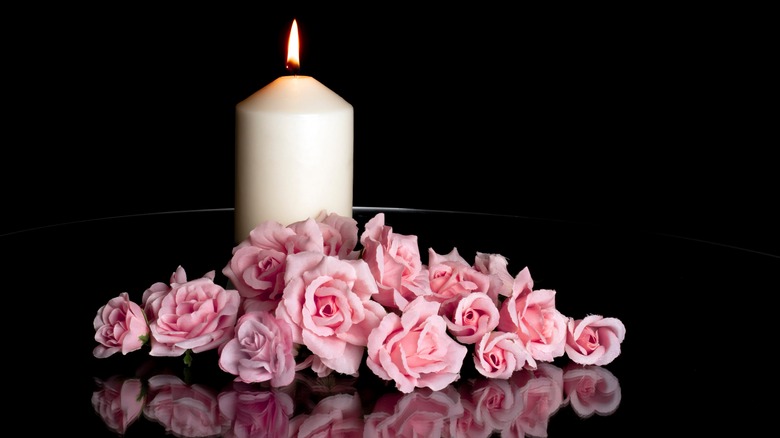 candle with pink flowers