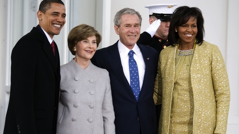 Obamas posing with the Bushes