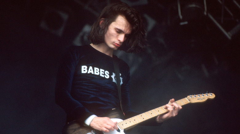 Jonny Greenwood playing on stage in the 1990s