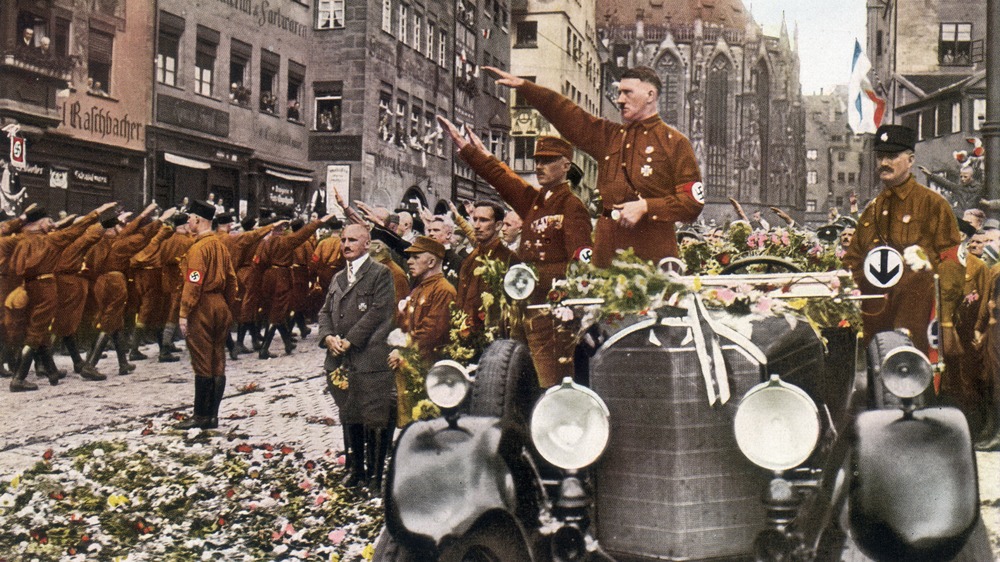 Adolph Hitler saluting troops