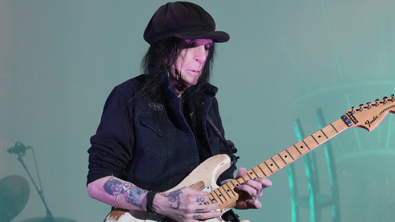 Mick Mars playing guitar