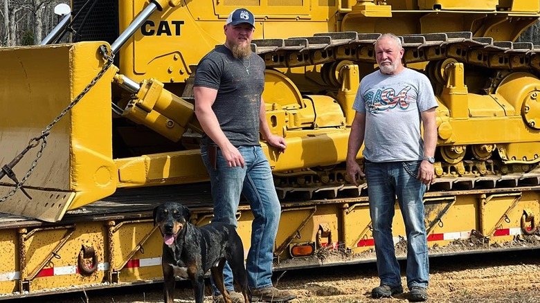 Tyler Wood and his father with a bulldozer