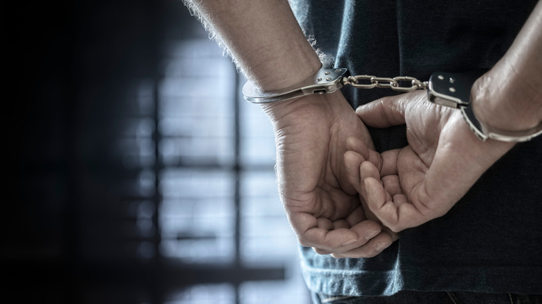 Incarcerated person in handcuffs