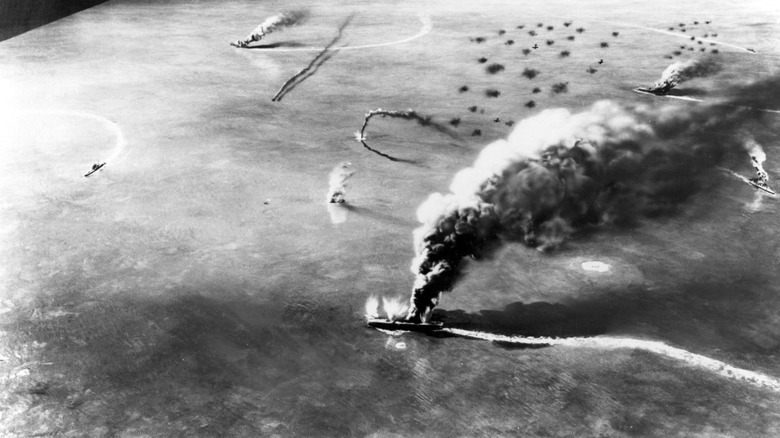 ships burn during a bombing raid